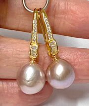 Elegant Oval Round 10.5x11mm Purple Pink Edison Cultured Pearl Dangle Discover the elegance of our Oval Round 10.5x11mm Purple Pink Edison Cultured Pearl Dangle Earrings. Featuring lustrous Edison pearls with a beautiful mix of purple EarringsFine JewelryThe Fine Pearls Jewelry5x11mm Purple Pink Edison Cultured Pearl Dangle Earrings – Trendy