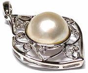 Elegant Solid 14K White Gold Natural White Round South Sea Mabe Pearl Embrace timeless luxury with our Elegant Solid 14K White Gold Natural White Round South Sea Mabe Pearl Pendant. This exquisite pendant features a stunning South Sea Charms & PendantsFine JewelryThe Fine Pearls JewelryElegant Solid 14K White Gold Natural White Round South Sea Mabe Pearl Pendant – Timeless Luxury