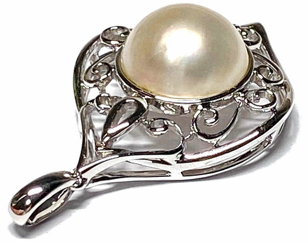 Elegant Solid 14K White Gold Natural White Round South Sea Mabe Pearl Embrace timeless luxury with our Elegant Solid 14K White Gold Natural White Round South Sea Mabe Pearl Pendant. This exquisite pendant features a stunning South Sea Charms & PendantsFine JewelryThe Fine Pearls JewelryElegant Solid 14K White Gold Natural White Round South Sea Mabe Pearl Pendant – Timeless Luxury