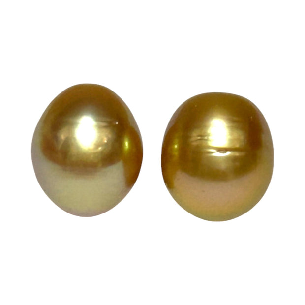 A Pair 11 x 13mm 22.8 Carats Deep Gold South Sea Oval Loose Pearls