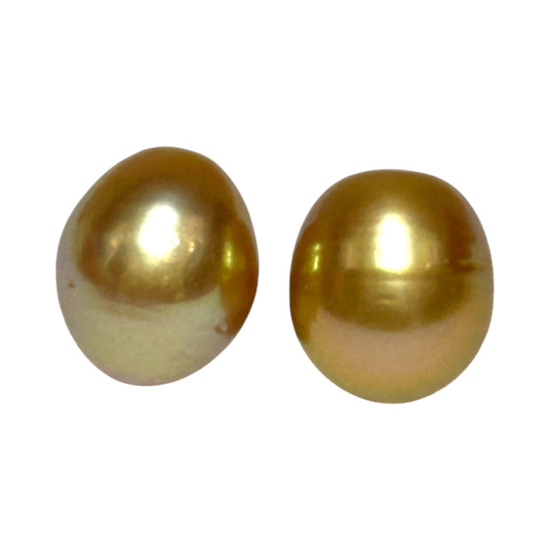 A Pair 11 x 13mm 22.8 Carats Deep Gold South Sea Oval Loose Pearls