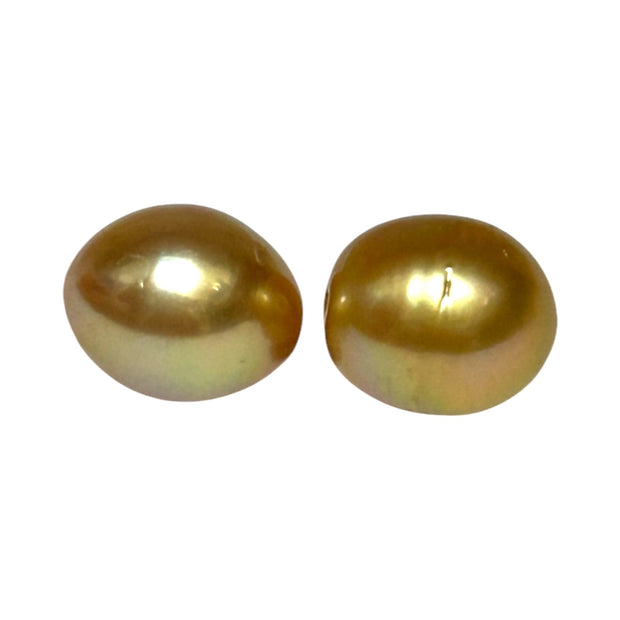 A Pair 11 x 13mm 22.8 Carats Deep Gold South Sea Oval Loose Pearls