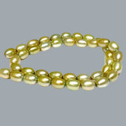 Smooth Oval 7 x 8.5mm Champagne Green Cultured FW Pearl 16" Strand