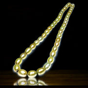 Smooth Oval 7 x 8.5mm Champagne Green Cultured FW Pearl 16" Strand