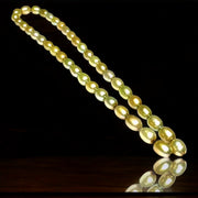 Smooth Oval 7 x 8.5mm Champagne Green Cultured FW Pearl 16" Strand