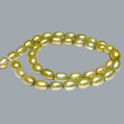 Smooth Oval 7 x 8.5mm Champagne Green Cultured FW Pearl 16" Strand