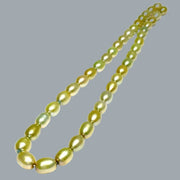 Smooth Oval 7 x 8.5mm Champagne Green Cultured FW Pearl 16" Strand